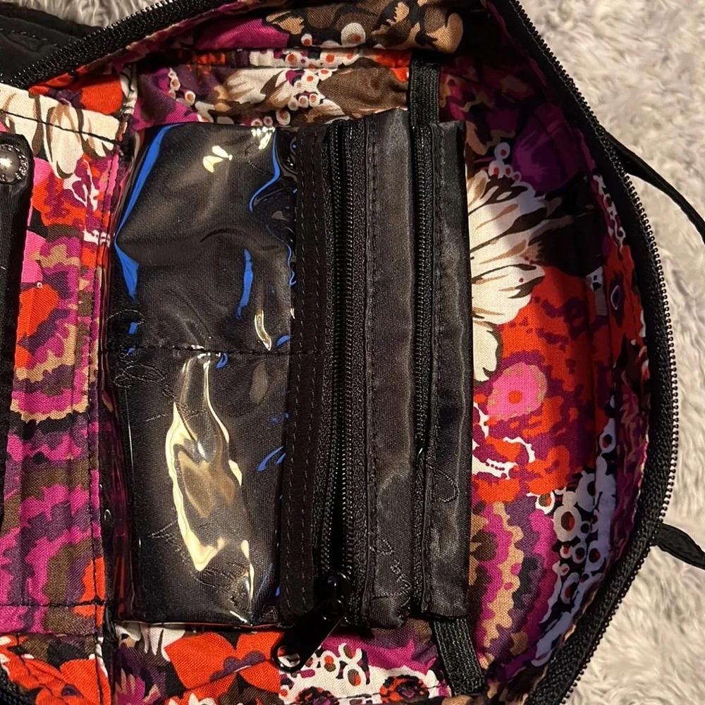 Vera Bradley black toiletry bag with 4 zippered pockets inside. Great condition!